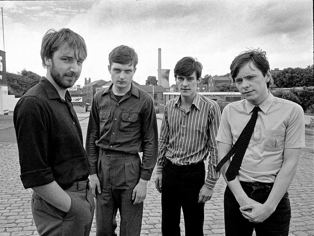 Picture By: Paul Slattery / Retna Pictures - Picture Shows: Portrait of Manchester band Joy Division photographed around Waterloo Road, Stockport, near Strawberry Studios. The band are Bernard Sumner (guitar and keyboards), Stephen Morris (drums and percussion), Ian Curtis (vocals and occasional guitar), Peter Hook (bass guitar and backing vocals). 28th July 1979. Its the 30th anniversary since Joy Division singer Ian Curtis committed suicide on May 18, 1980. - Job: 86474 Ref: PTY - World Rights *Unbylined uses will incur an additional discretionary fee!* **HIGHER RATES APPLY *